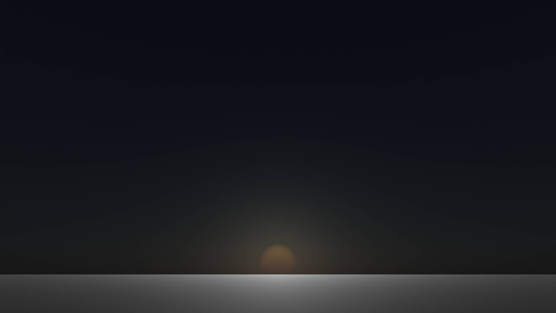 A dark, almost black sky, with a reddening sun near the horizon