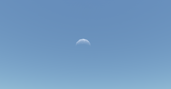 A crescent moon in the blue day sky